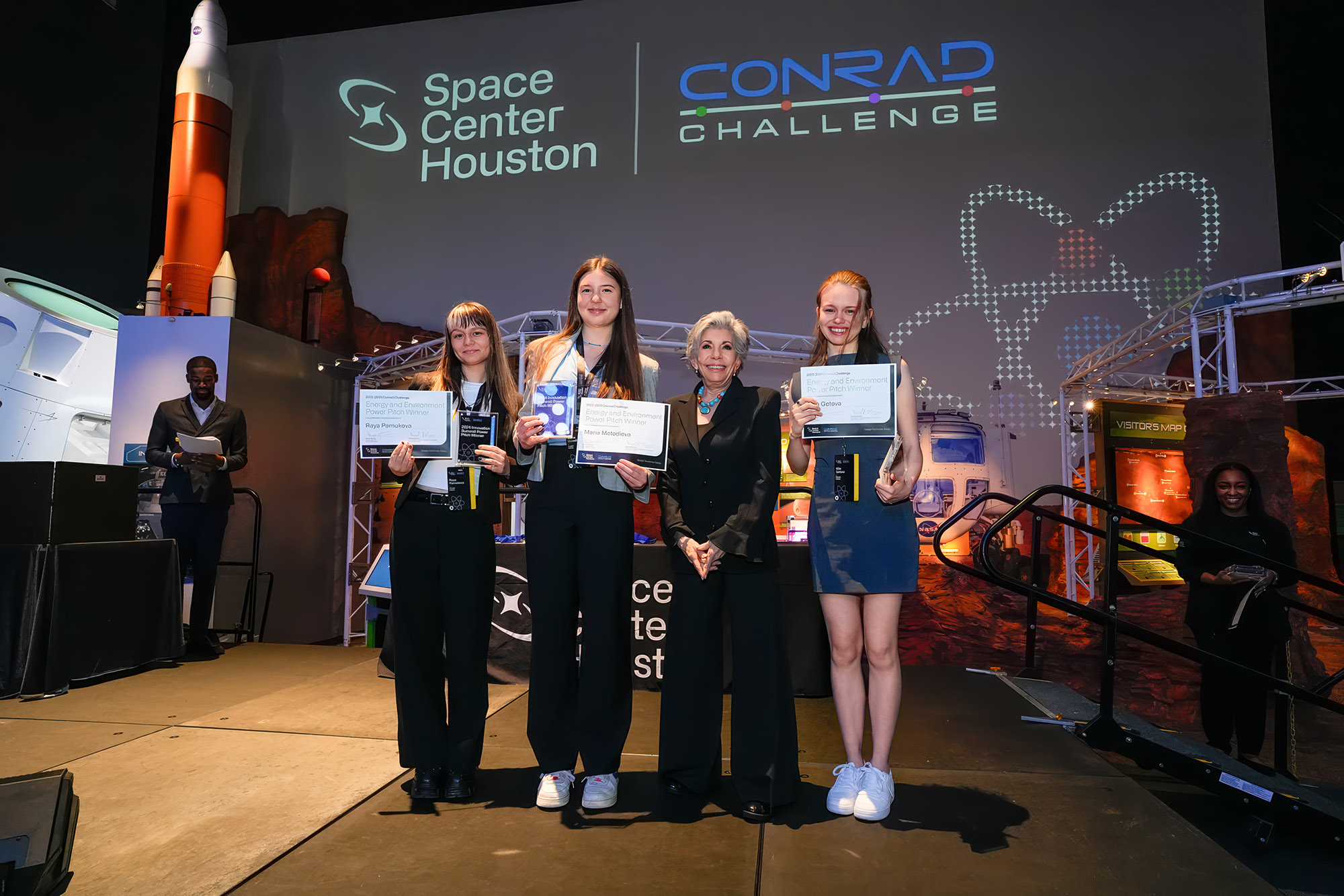 Maria (centre) and teammates presenting their solution a the Women and Girls in STEM Forum in Brussels, 2023