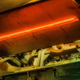 The bushing nozzle used to draw fibres during FibreCoat’s production process. Photo: Fibrecoat