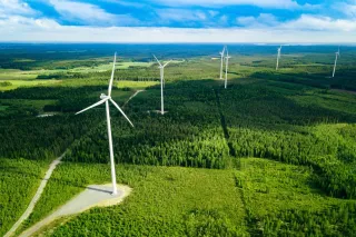 Aerial View Of Windmills In Green Summer Forest In Finland
