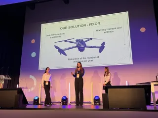 Maria (centre) and teammates presenting their solution a the Women and Girls in STEM Forum in Brussels, 2023